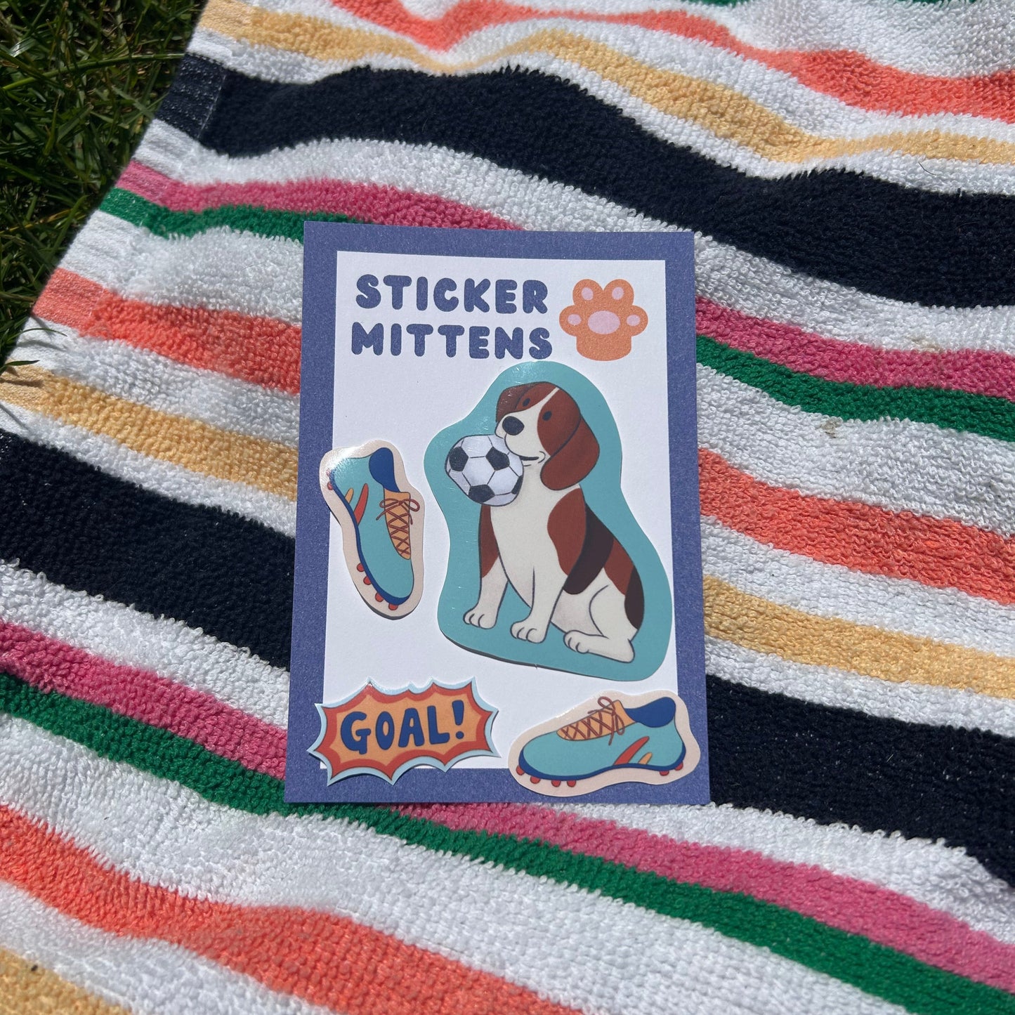 Stickers with a dog design on a striped towel
