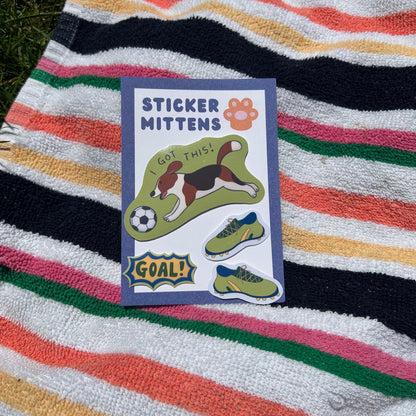 soccer dog sticker with 'Sticker Mitten' design on a striped towel